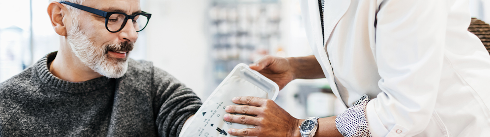 man getting his blood pressure checked